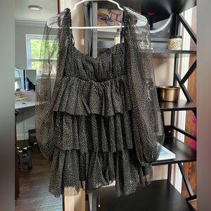 Tiered black and gold mini dress with puff sleeves